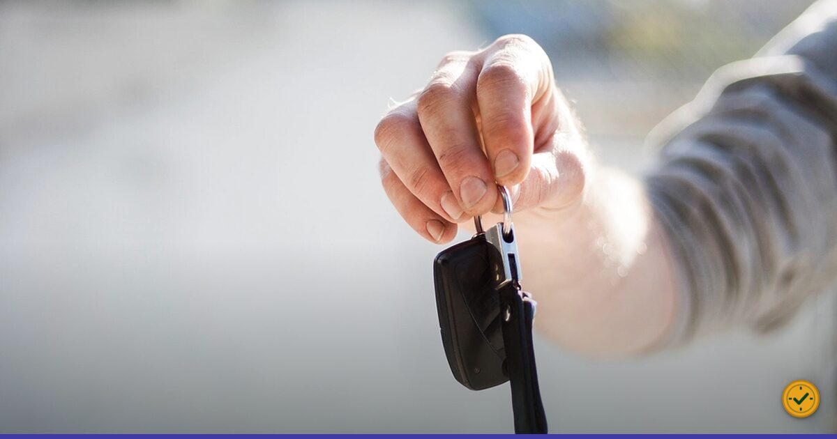 Hand holding a car key