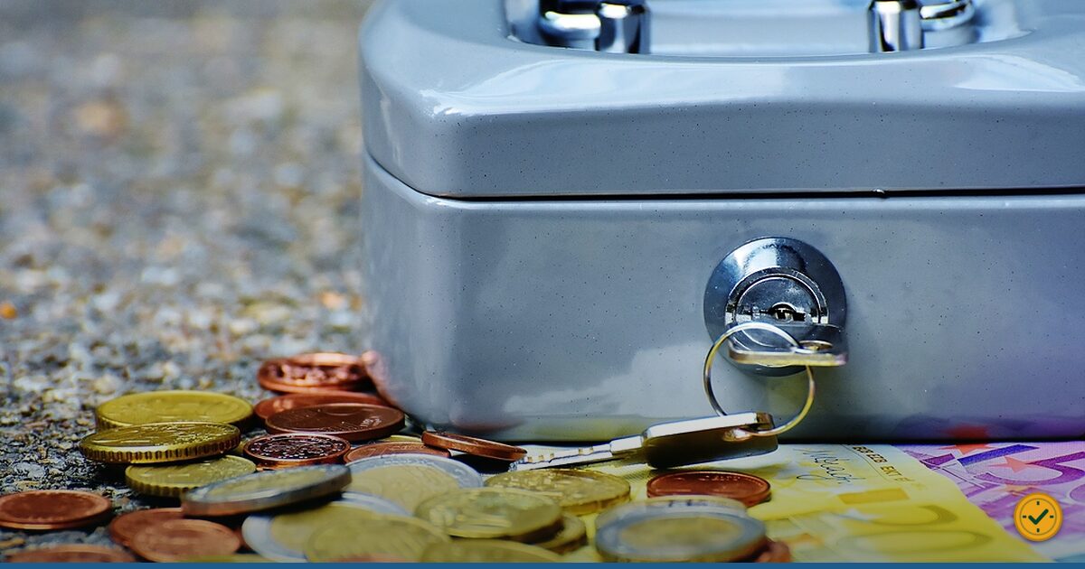A two-pound coin resting on banknotes