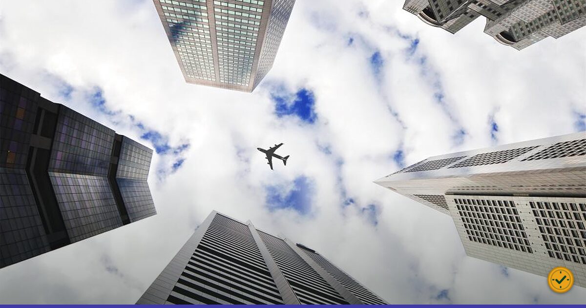 Aeroplane crossing a cloudy sky